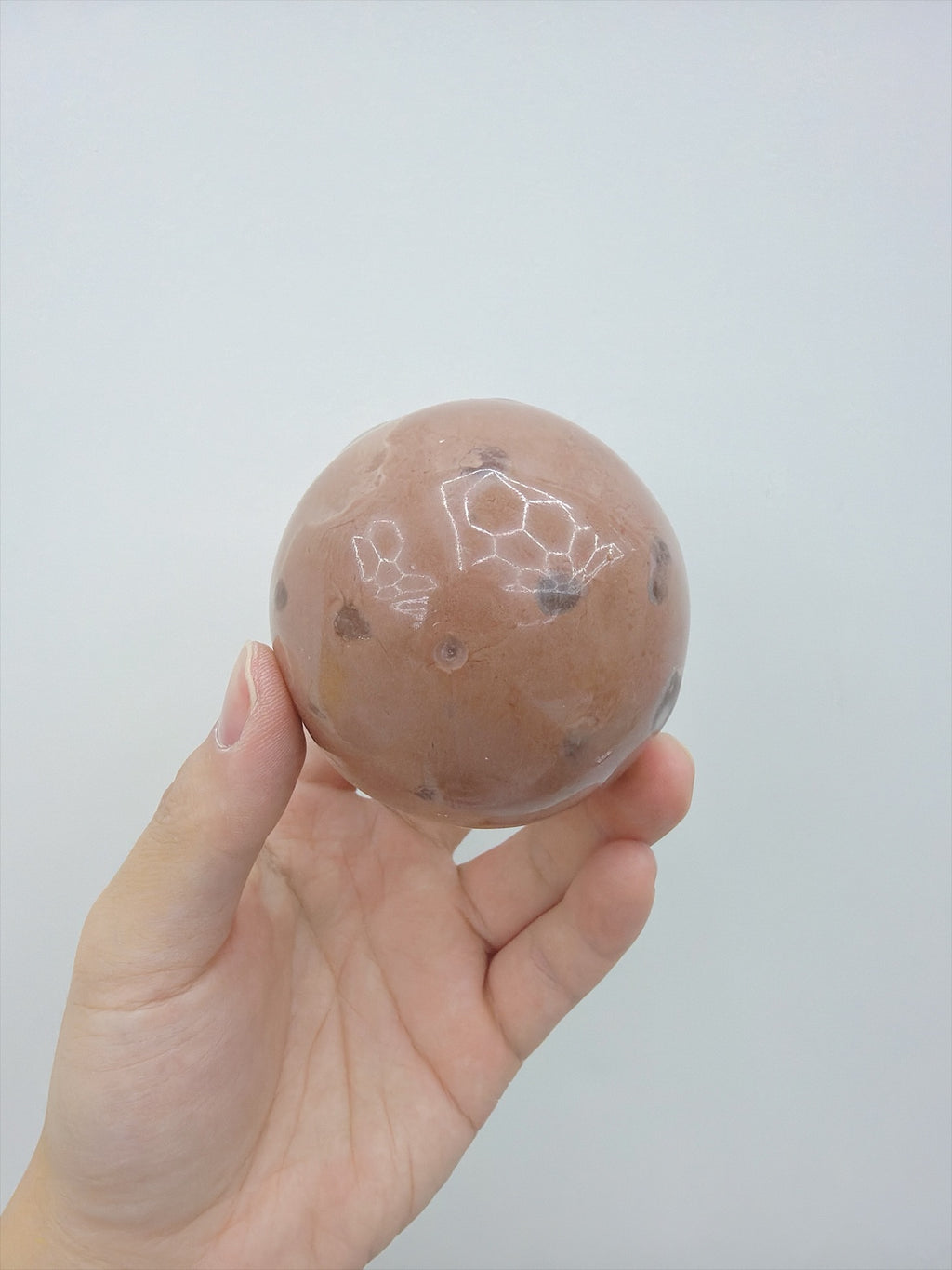 Real Touch Me cocoa soft crunchy ball squishy in hand