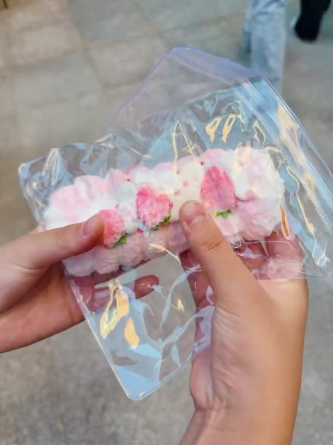 Real Candy Dream strawberry roll squishy in hand
