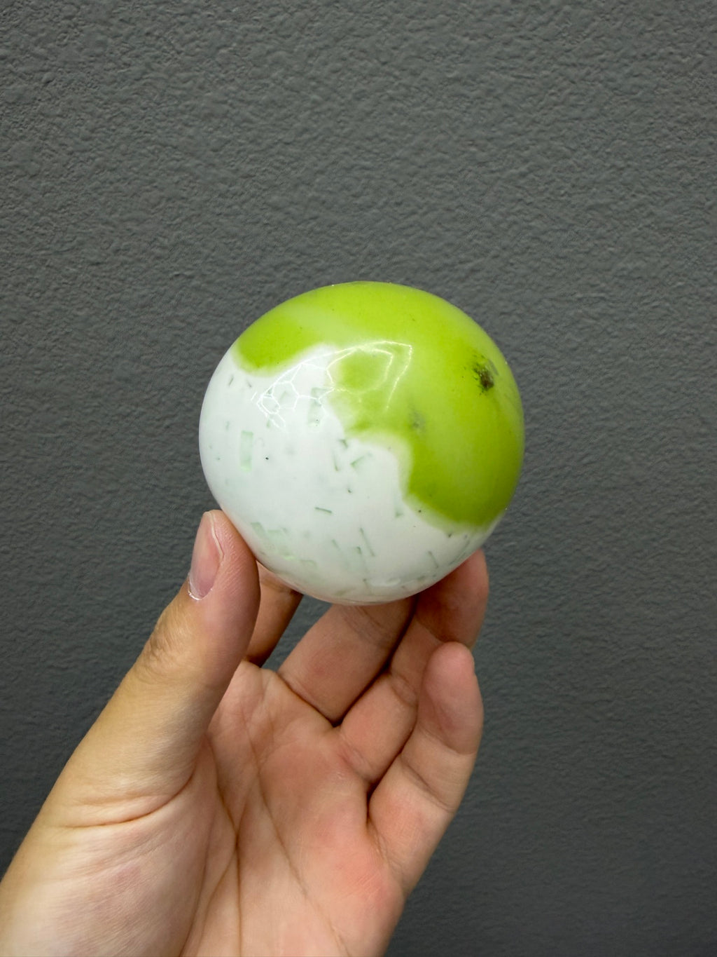 Real Touch Me melon ball squishy in hand