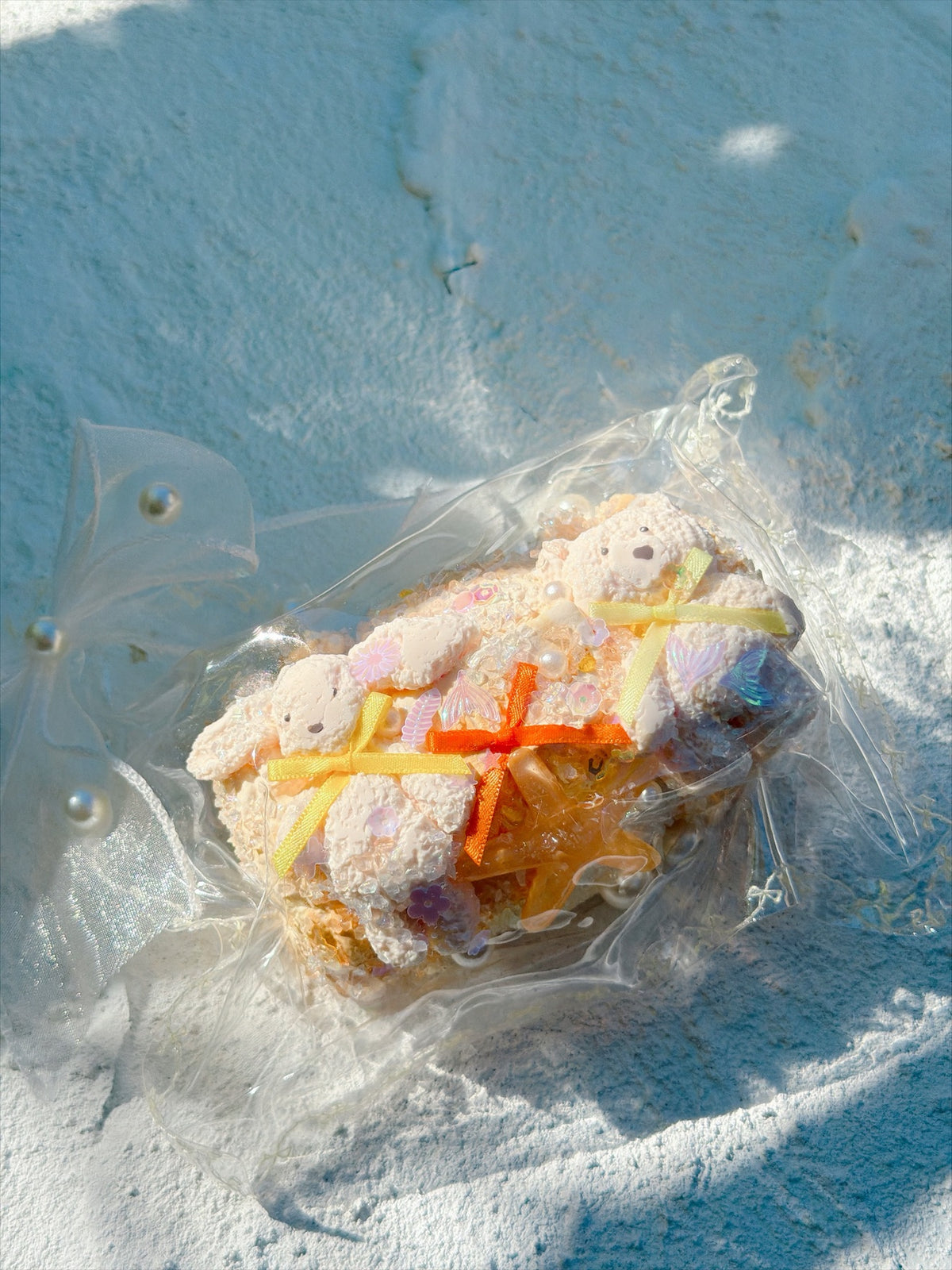 Wonder Village bear starfish squishy with white bears, ribbons and starfish, in a clear bag