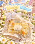 Wonder Village lemon bunny squishy with yellow bow, orange slices and pearls, in a miniature village scene