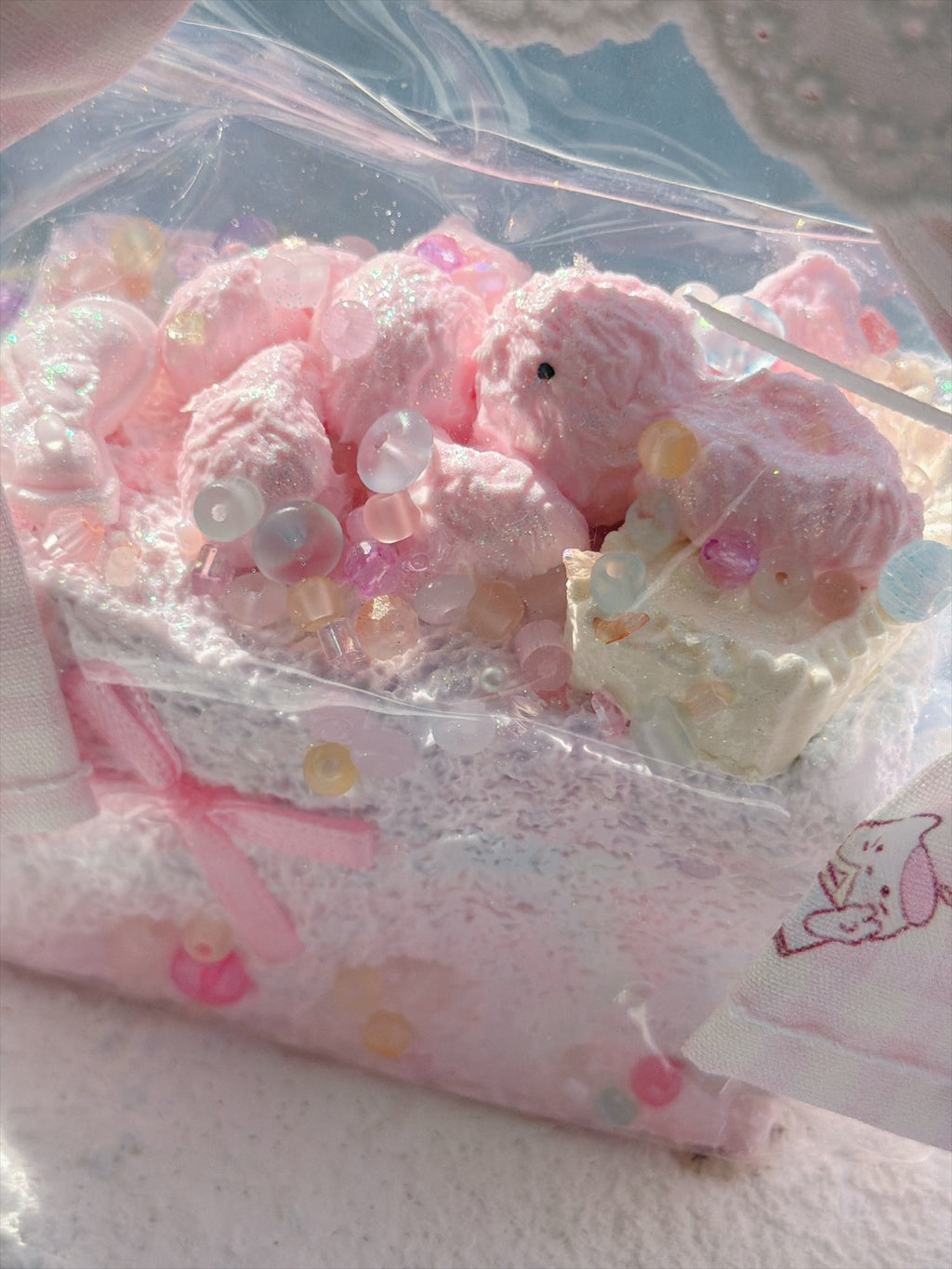 Wonder Village pink basket squishy, pink squishy with pastel beads, close view