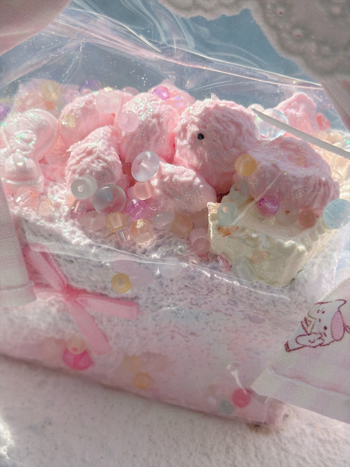 Wonder Village pink basket squishy, pink squishy with pastel beads, close view